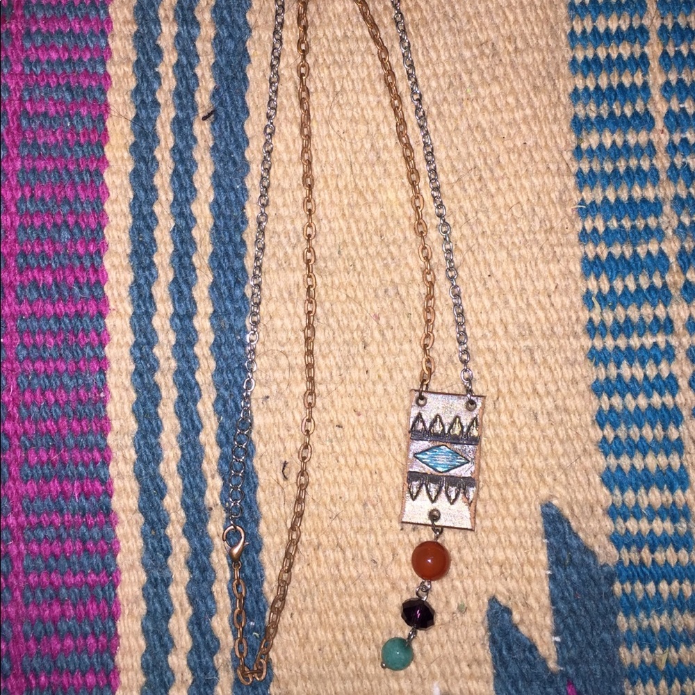 Hand tooled leather necklace